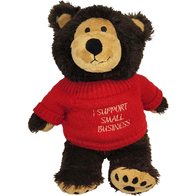Bravo Bear plush toy wearing a sweater reading, I support small business