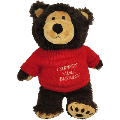 Bravo Bear plush toy wearing a sweater reading, I support small business